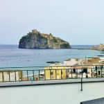 Rooftop drinks with a view of Castello Aragonese Ischia Island