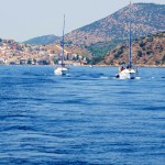 Boats motoring in the Saronic Islands by Patrick Bellew