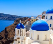 Panoramic view Santorini with blue domed church