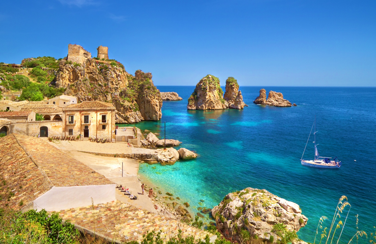 Tonnara di Scopello bay with yacht 1500x976