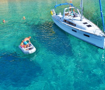 Beneteau 35 anchored in a bay on Kastus Island