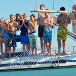 Children jumping off the boat