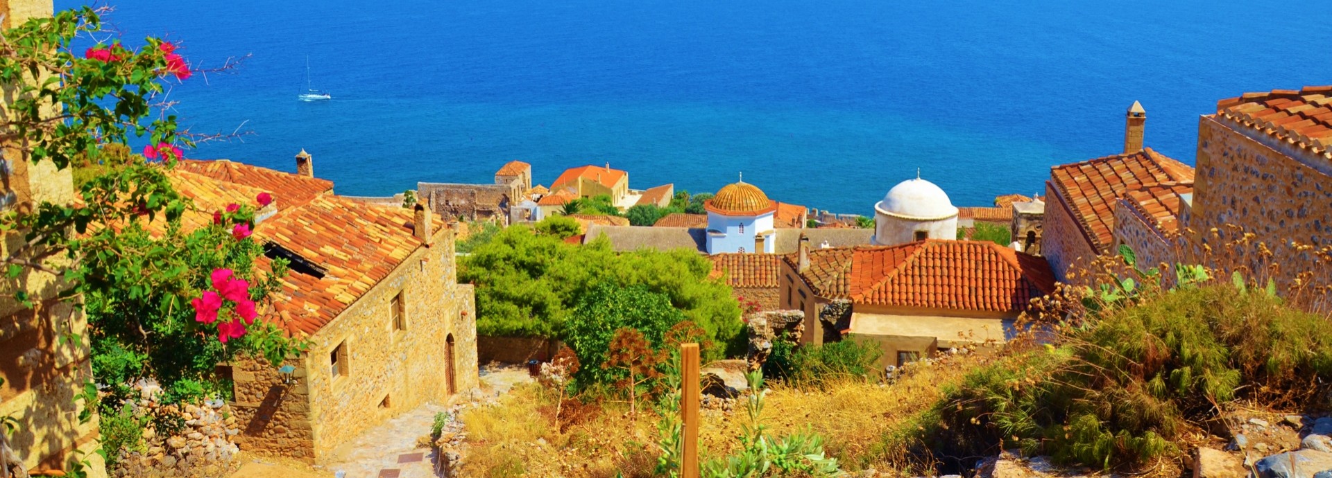 Sailing past Monemvasia in the Saronic Islands