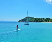 Stand Up Paddle Boarding whilst anchored at Koukounaries Beach on Skiathos Island